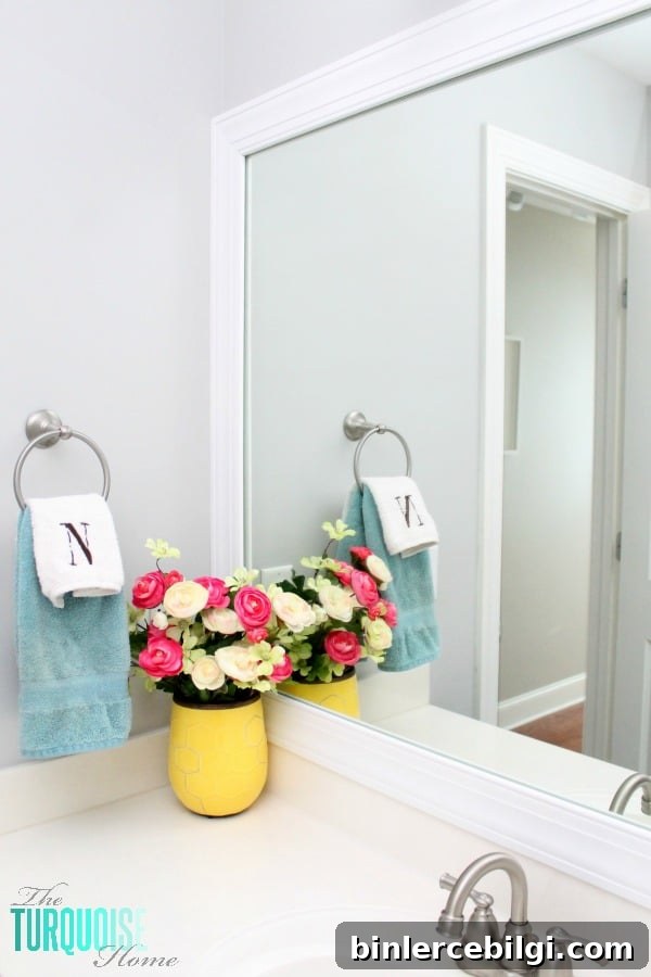 This simple DIY is easy and cheap! LOVE the custom look! | How to Frame a Builder-Grade Mirror | TheTurquoiseHome.com