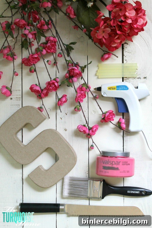 I love this sweet and simple DIY project - perfect for a baby girl's nursery | DIY Flower and Moss Initial Art via TheTurquoiseHome.com