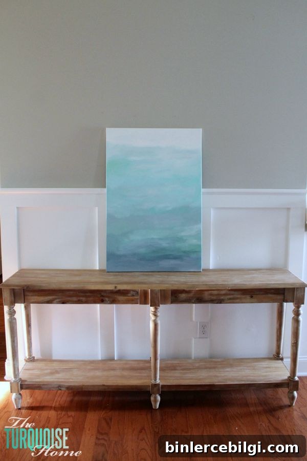 Gorgeous blue waters have the makings of an expensive abstract art piece, but it's not! It's a quick DIY project with just paint and a canvas! Less then $22 for custom, gorgeous art in your home. | Tutorial at TheTurquoiseHome.com