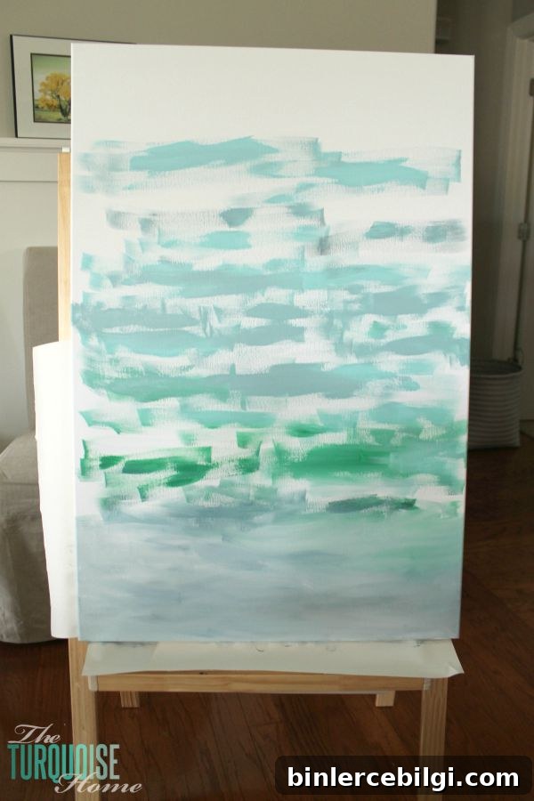Gorgeous blue waters have the makings of an expensive abstract art piece, but it's not! It's a quick DIY project with just paint and a canvas! Less then $22 for custom, gorgeous art in your home. | Tutorial at TheTurquoiseHome.com