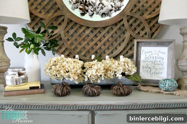 The temps are cooling down and it's time to break out the sweaters and the boots. Love this neutral fall vignette! (and a Come Thou Fount free printable) | Details and Printable at TheTurquoiseHome.com