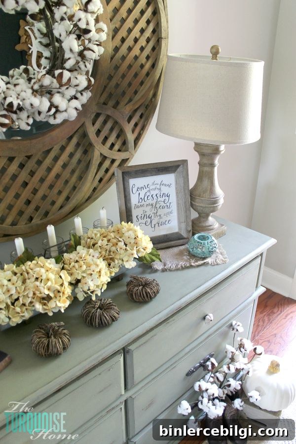 The temps are cooling down and it's time to break out the sweaters and the boots. Love this neutral fall vignette! (and a Come Thou Fount free printable) | Details and Printable at TheTurquoiseHome.com