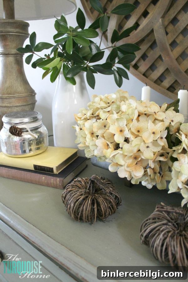 The temps are cooling down and it's time to break out the sweaters and the boots. Love this neutral fall vignette! (and a Come Thou Fount free printable) | Details and Printable at TheTurquoiseHome.com
