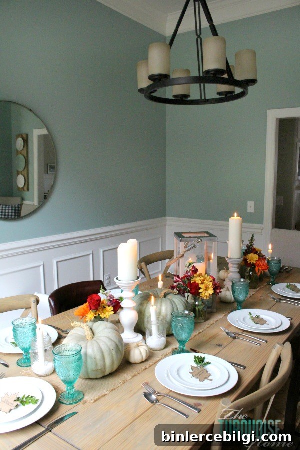 Gorgeous! This pretty, colorful fall or Thanksgiving tablescape is just beautiful with pops of turquoise, orange and red! And those beautiful goblets are my fave!