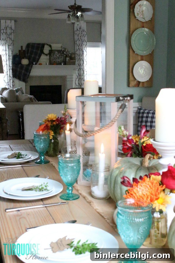 Gorgeous! This pretty, colorful fall or Thanksgiving tablescape is just beautiful with pops of turquoise, orange and red! And those beautiful goblets are my fave!