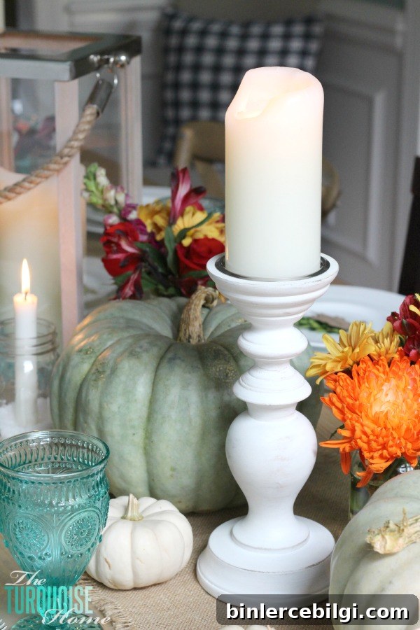 Gorgeous! This pretty, colorful fall or Thanksgiving tablescape is just beautiful with pops of turquoise, orange and red! And those beautiful goblets are my fave!