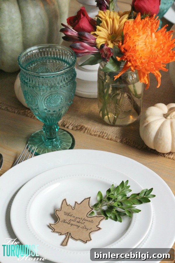 Gorgeous! This pretty, colorful fall or Thanksgiving tablescape is just beautiful with pops of turquoise, orange and red! And those beautiful goblets are my fave!