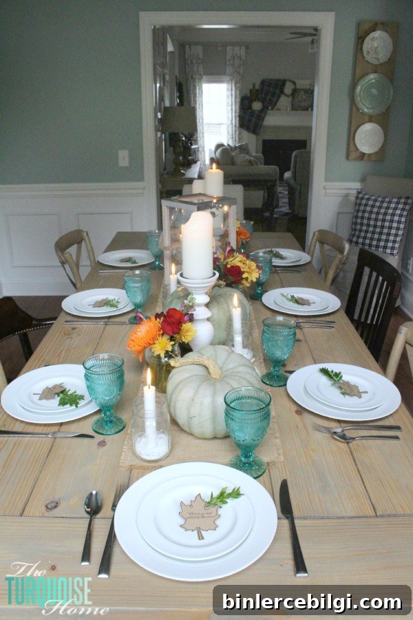 Gorgeous! This pretty, colorful fall or Thanksgiving tablescape is just beautiful with pops of turquoise, orange and red! And those beautiful goblets are my fave!