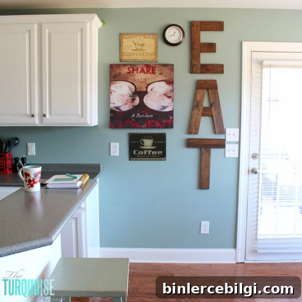 DIY Painted Kitchen Cabinets with Benjamin Moore Simply White and EAT sign from pallets | Details at TheTurquoiseHome.com