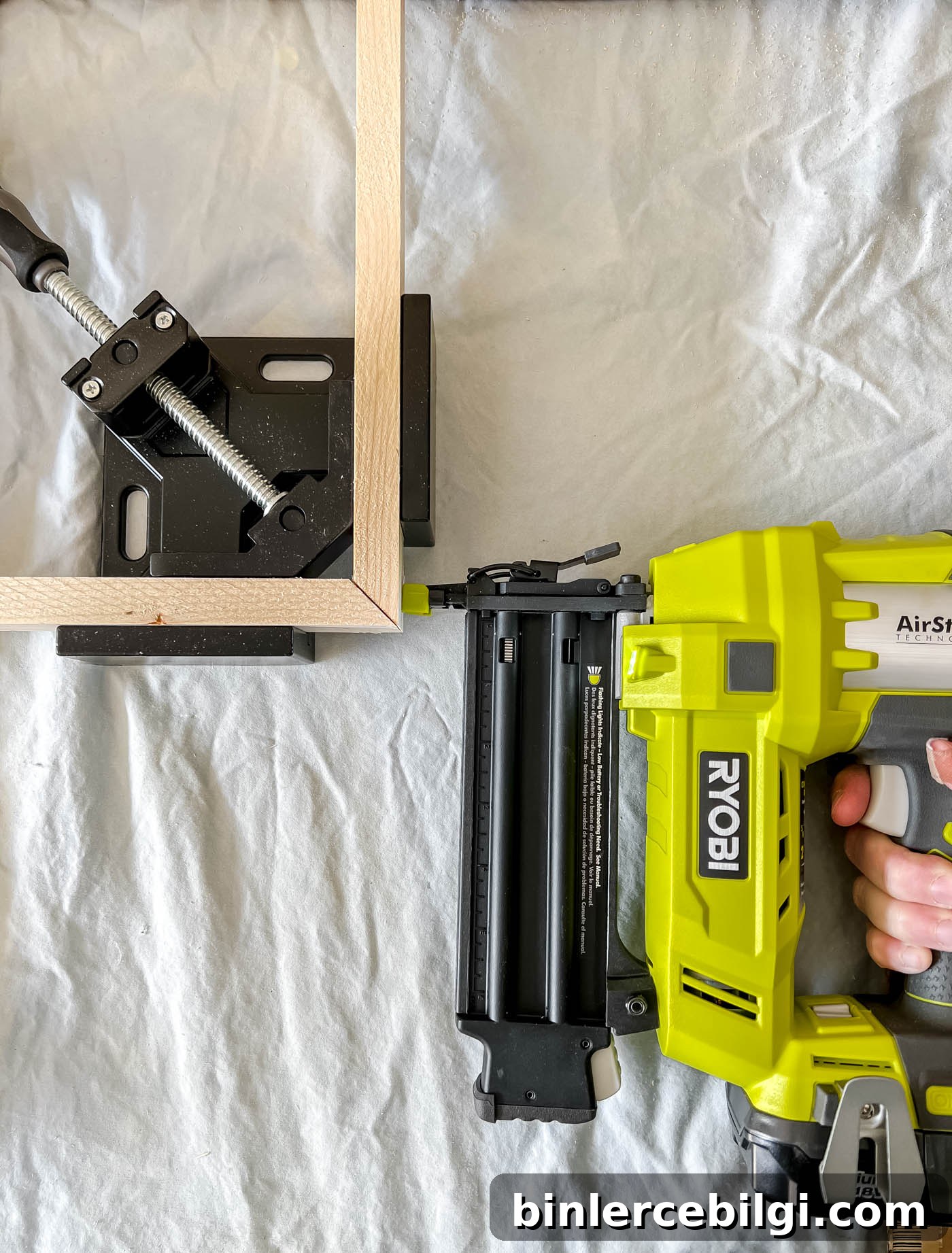 stapling the wood frame