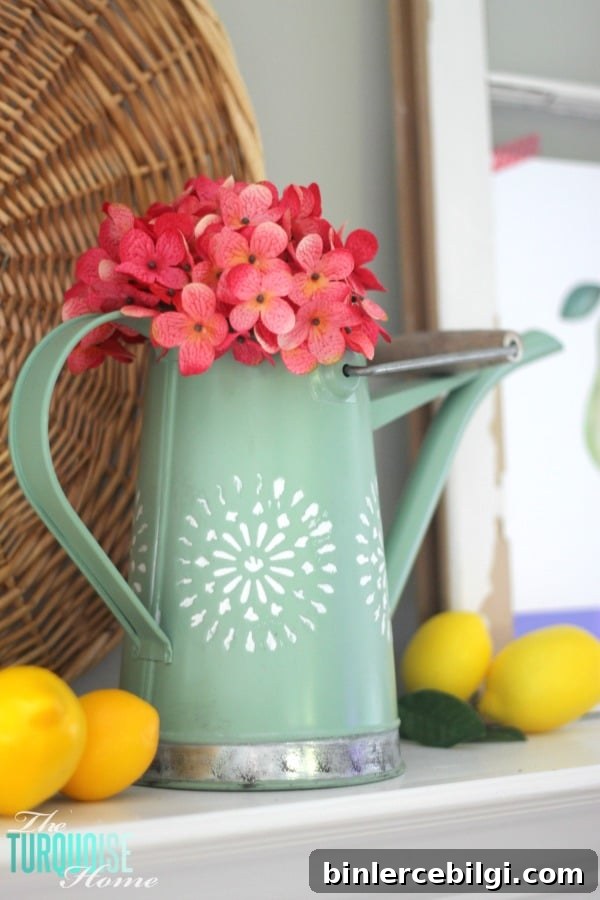 I love these fresh pops of colors and citrus inspiration on this fun summer mantel! A Garden and Lemonade Stand Summer Mantel. Get all the juicy details at TheTurquoiseHome.com