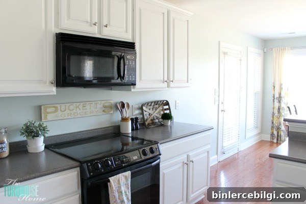 How to Measure and Install Cabinet Pulls Precisely 2 Love this light and airy farmhouse look!! Kitchen painted in Sea Salt (Sherwin Williams). | All the details at TheTurquoiseHome.com