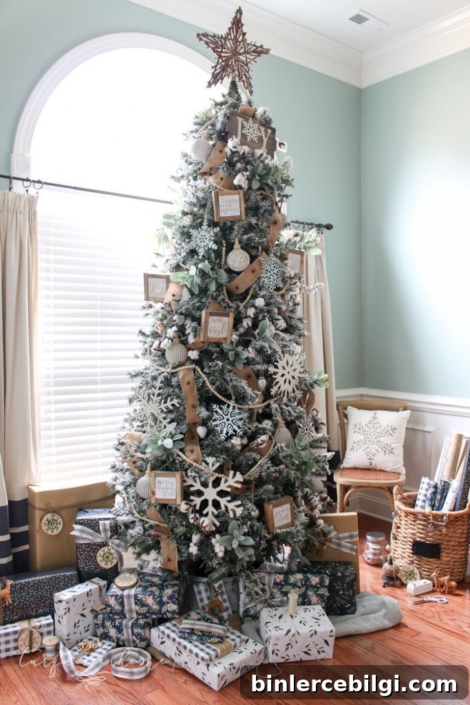 My Flocked Farmhouse Christmas Tree - super cute cotton stems, lamb's ear, galvanized snowflakes, and wooden bead garland.