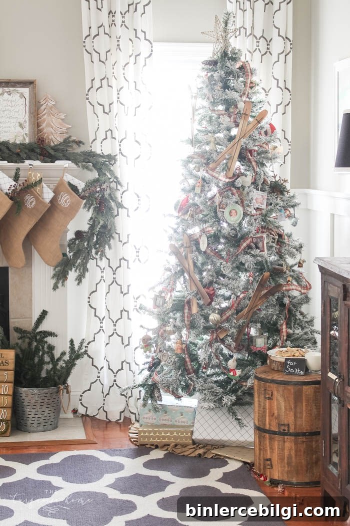Pretty magnolia wreath Christmas mantel decor brings a rustic feel to the holiday season. Pops of navy and dusty blue are festive, yet unexpected! | Gorgeous Magnolia Wreath Christmas Mantel Decor