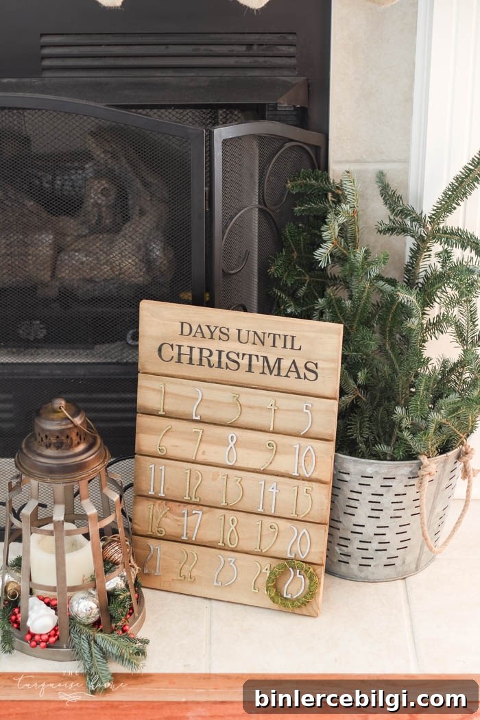 Pretty magnolia wreath Christmas mantel decor brings a rustic feel to the holiday season. Pops of navy and dusty blue are festive, yet unexpected! | Gorgeous Magnolia Wreath Christmas Mantel Decor