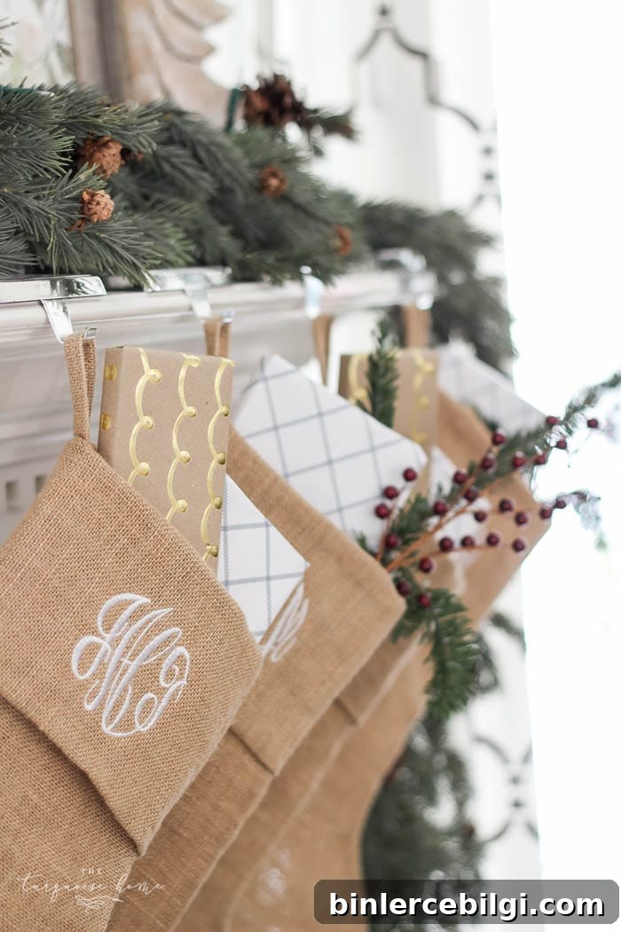 Pretty magnolia wreath Christmas mantel decor brings a rustic feel to the holiday season. Pops of navy and dusty blue are festive, yet unexpected! | Gorgeous Magnolia Wreath Christmas Mantel Decor