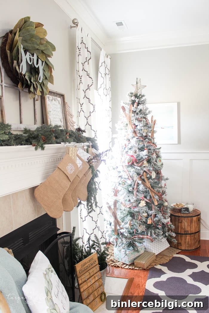 Pretty magnolia wreath Christmas mantel decor brings a rustic feel to the holiday season. Pops of navy and dusty blue are festive, yet unexpected! | Gorgeous Magnolia Wreath Christmas Mantel Decor