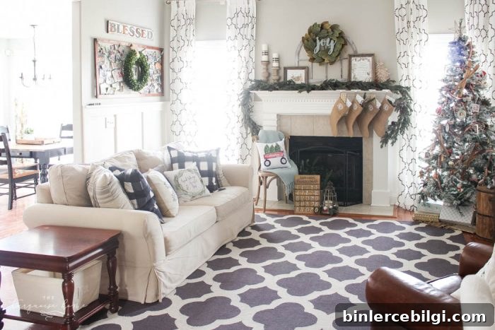 Pretty magnolia wreath Christmas mantel decor brings a rustic feel to the holiday season. Pops of navy and dusty blue are festive, yet unexpected! | Gorgeous Magnolia Wreath Christmas Mantel Decor