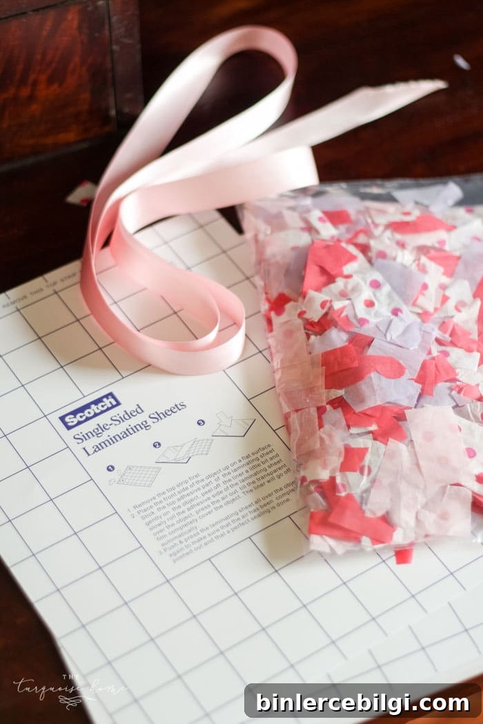 We used this in my daughter's Kindergarten class party! The kids LOVED it! | DIY Tissue Paper Sun Catcher Valentine's Kid Craft
