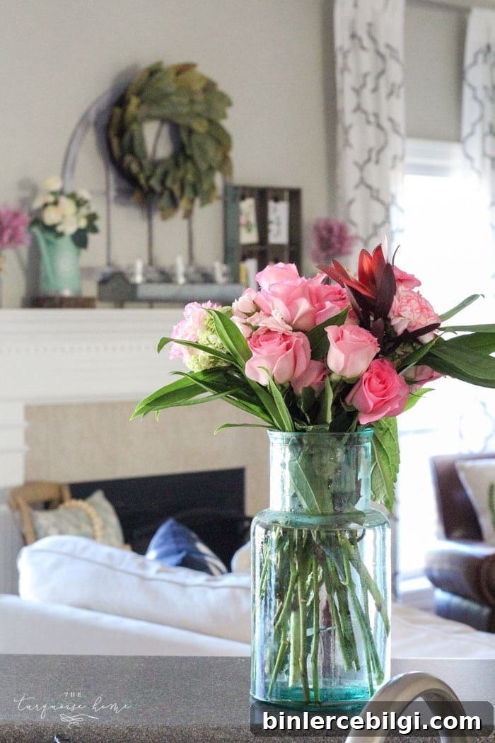 Isn't this just the prettiest pink and turquoise mantel?! Simple Floral Spring Mantel