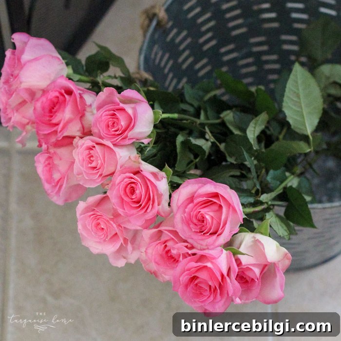 Isn't this just the prettiest pink and turquoise mantel?! Simple Floral Spring Mantel