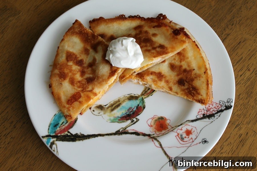 Chicken Quesadilla Recipe with a Secret Ingredient 6 Golden crispy quesadilla cooking in a pan