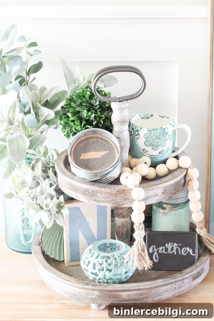 Wood bead garland displayed with decor on a shelf.