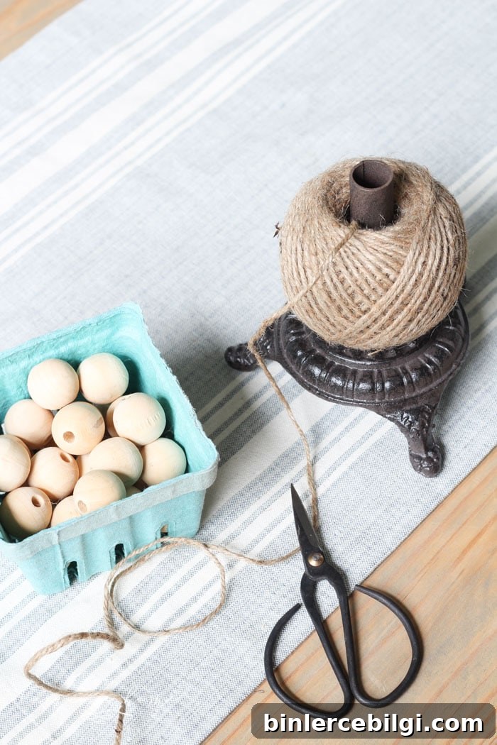 Super cute DIY Wood Bead Garland with Tassels is so easy and fun to make! Cheap, too!!
