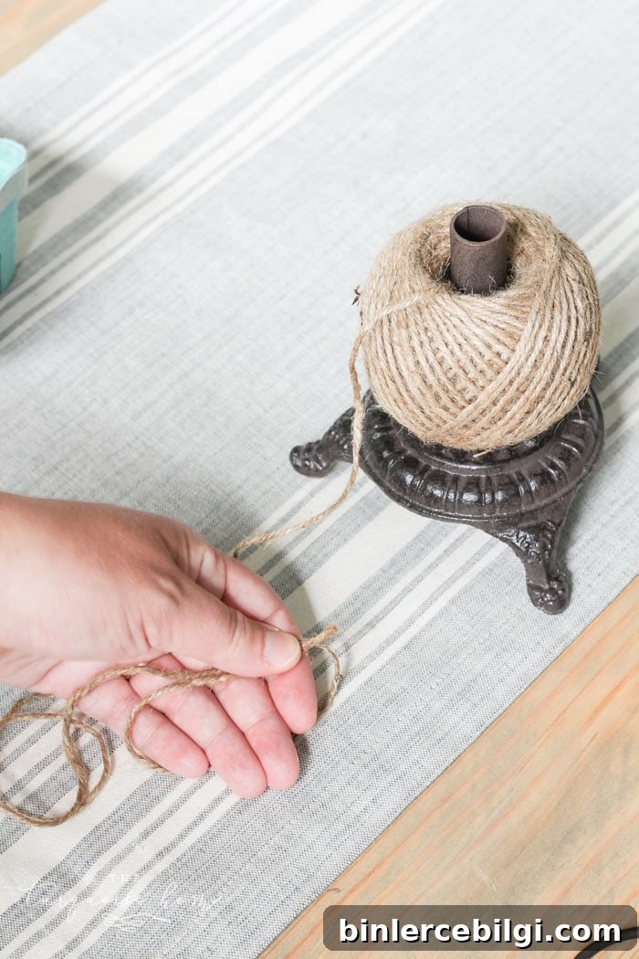 Tying and preparing the tassel for the wood bead garland.
