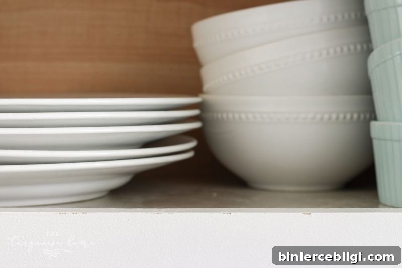Cabinets painted in Benjamin Moore's Simply White are holding up extremely well after 2 years!