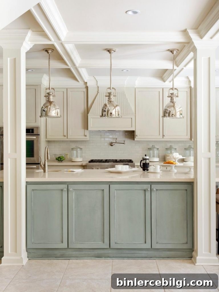 A Distressed Duck Egg Blue kitchen Island with shiny stainless steel pendant lights.