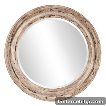 10 Large Round Mirrors That Transform Any Room 9 Elizabeth Austin Maisey Wall Mirror from Hayneedle | Love the finish on this one! It definitely would go with my coastal farmhouse style. | 10 Large Round Mirrors We Love!