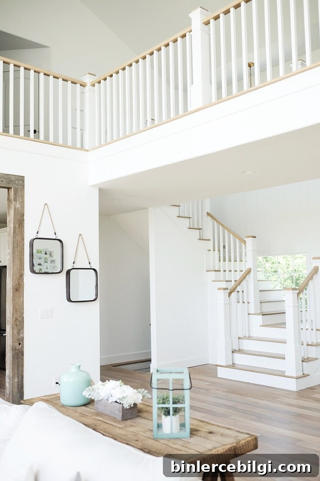 Extra White Paint Color from Sherwin Williams is GORGEOUS in this staircase landing space. LOVE!! | Top Favorite White Paint Colors 