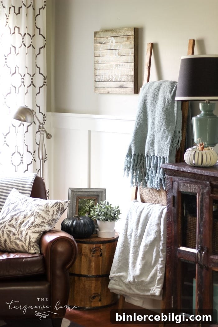 A cozy fall corner with a blanket ladder, leather armchair - and pumpkins!! | Simple farmhouse fall mantel with a DIY wooden sign 