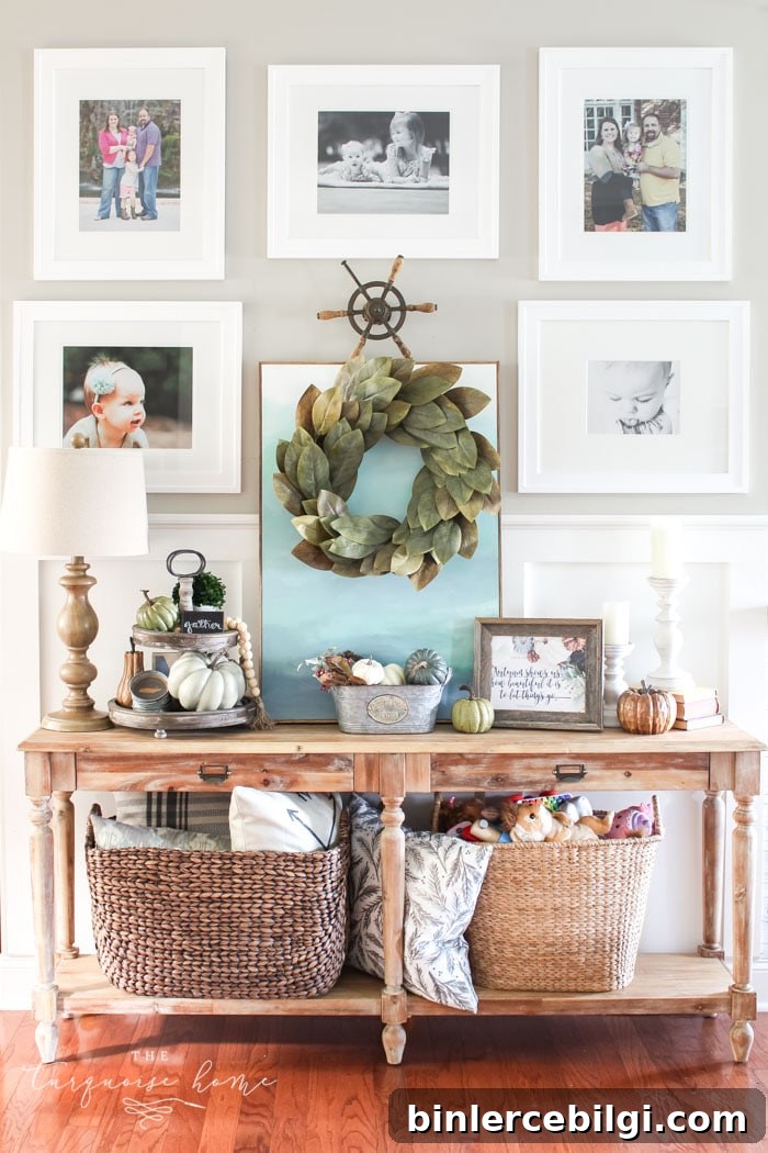 Love this #fixerupper style! Fall console table and gallery wall with tiered farmhouse stand and magnolia wreath