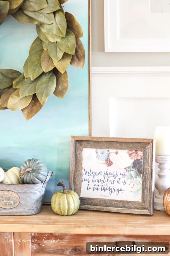 Love this #fixerupper style! Fall console table and gallery wall with tiered farmhouse stand and magnolia wreath