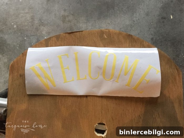 Use vinyl letters to create a welcoming message for your DIY Lighted Pumpkin Candy Holder.
