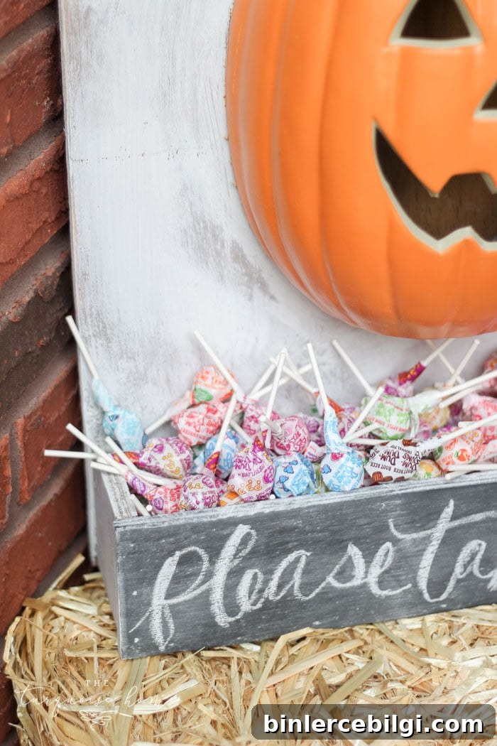Adorable DIY lighted pumpkin candy holder - perfect for Halloween night!