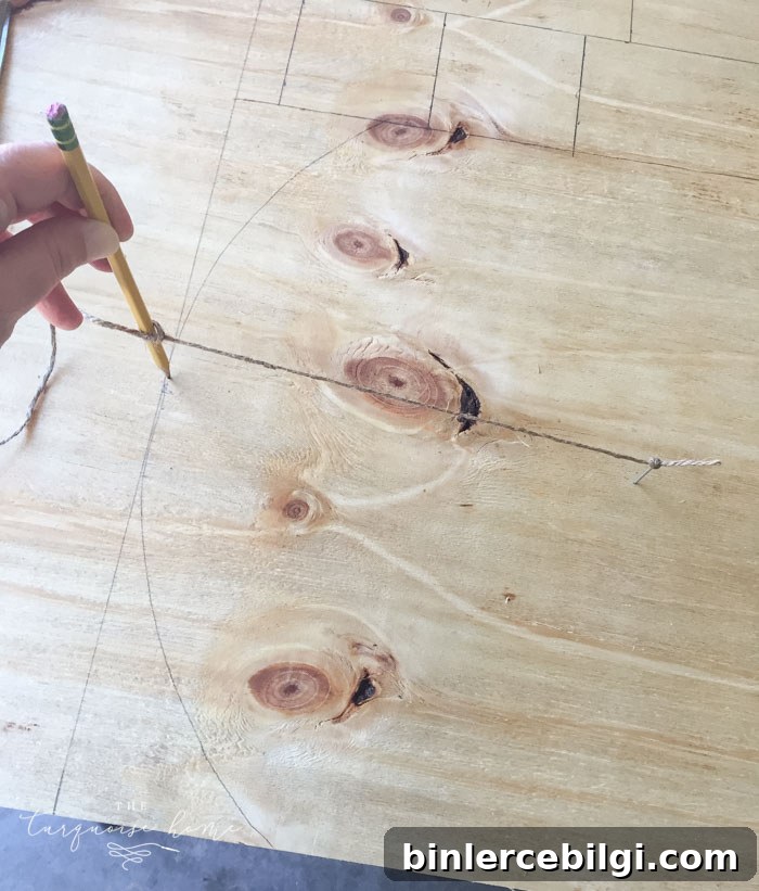 Draw an arc on the top of the gravestone/back of the box for the DIY Lighted Pumpkin Candy Holder.