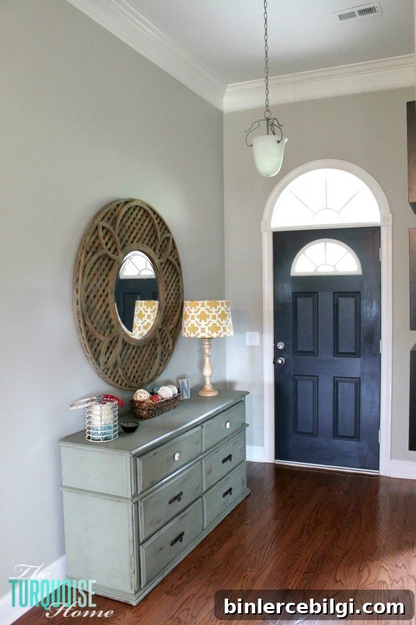 This builder-basic pendant needs an update! Darlana Pendant Lantern Knock-off for the Foyer! LOVE this light for less than $100!!