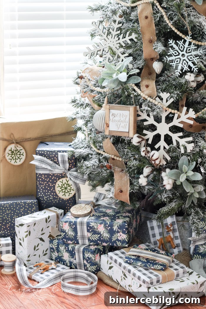 My Flocked Farmhouse Christmas Tree - super cute cotton stems, lamb's ear, galvanized snowflakes, and wooden bead garland.