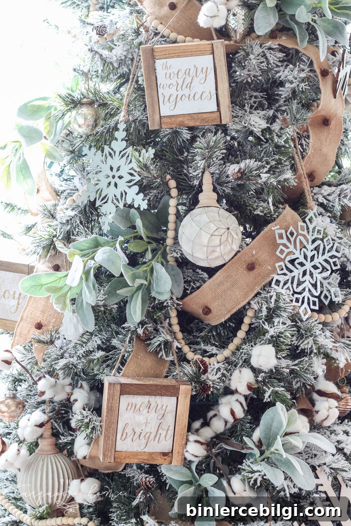 My Flocked Farmhouse Christmas Tree - super cute cotton stems, lamb's ear, galvanized snowflakes, and wooden bead garland.
