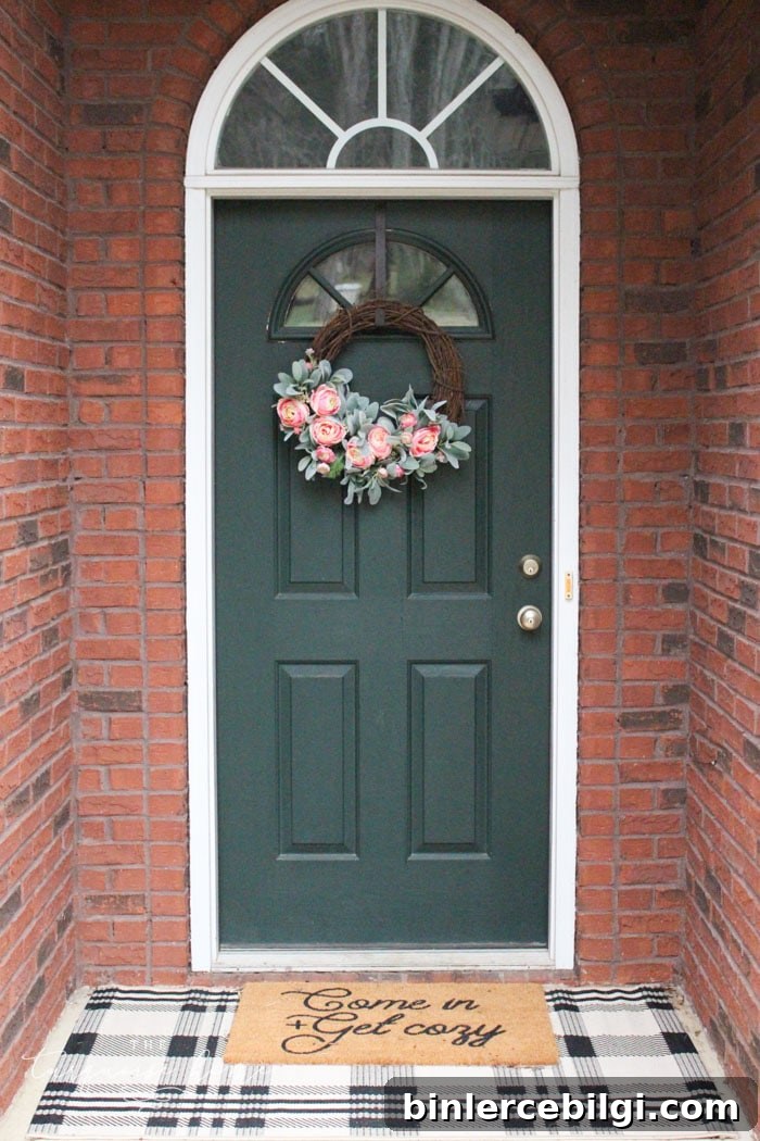 Front door with layered doormats and DIY peonies spring wreath!