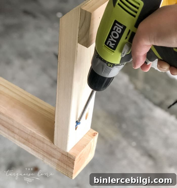 DIY Wooden Coat Rack: Step-by-Step Build Guide 8 Add the legs to the end of the post with Kreg Jig Screws! #buildyourownathome #diyproject #diy #buildlikeagirl