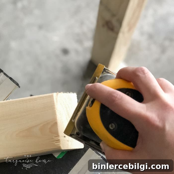 DIY Wooden Coat Rack: Step-by-Step Build Guide 11 Sand down the whole DIY Coat Rack to make sure there are no splinters or rough spots! Then wipe down with a damp cloth. | Standing Coat Rack | #buildyourownathome #diyproject #diy #buildlikeagirl