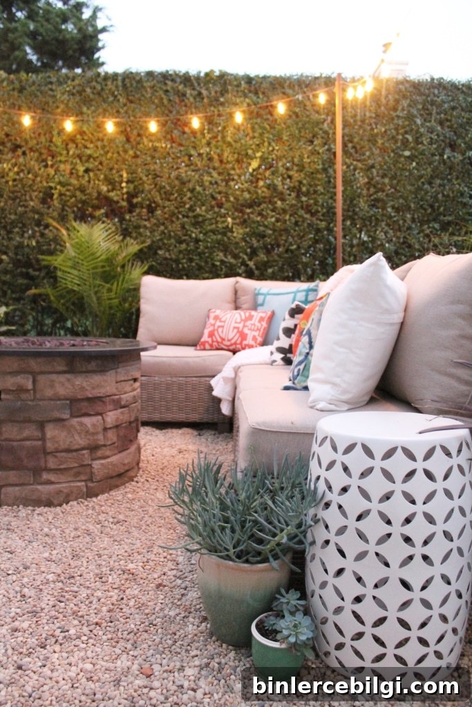 Dreamy Hamptons Backyard Barbecue with sofa and string lights.