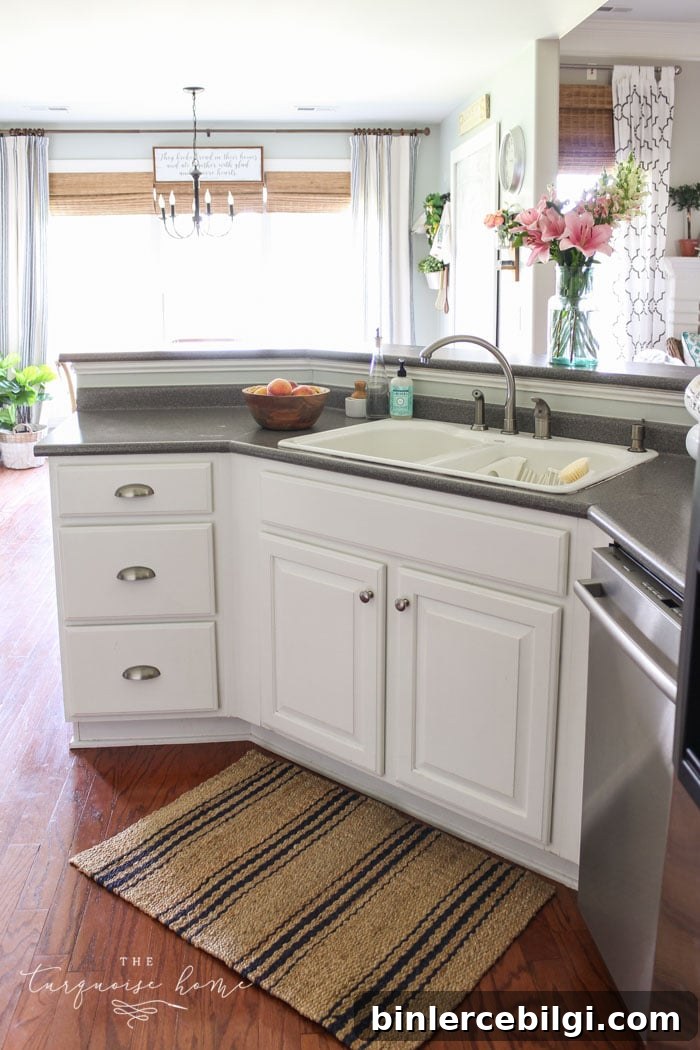 The new jute and navy striped rug is my favorite! Summer Home Tour in the Kitchen