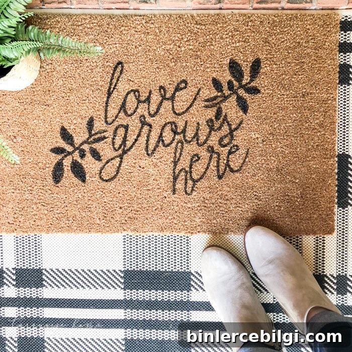 DIY doormat that says "love grows here"