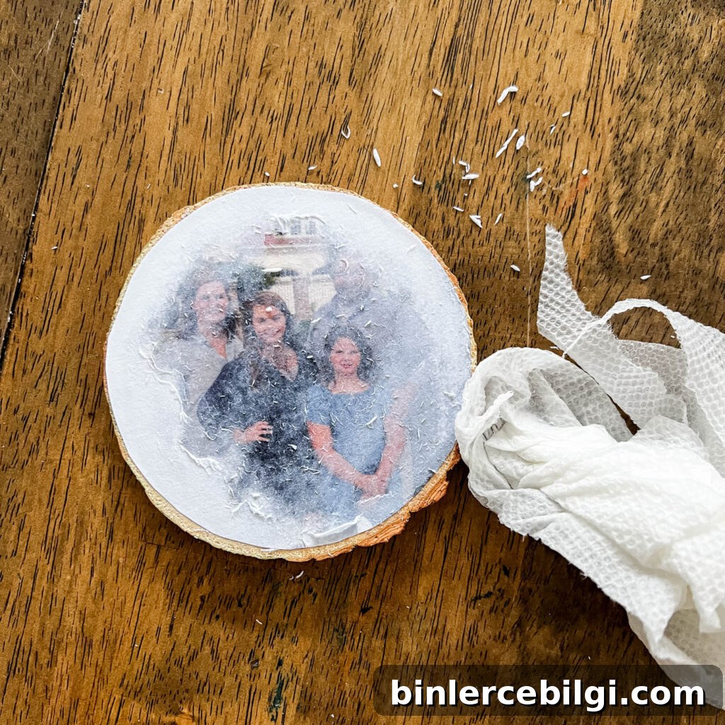 rub off the paper with a damp cloth to reveal the photo below
