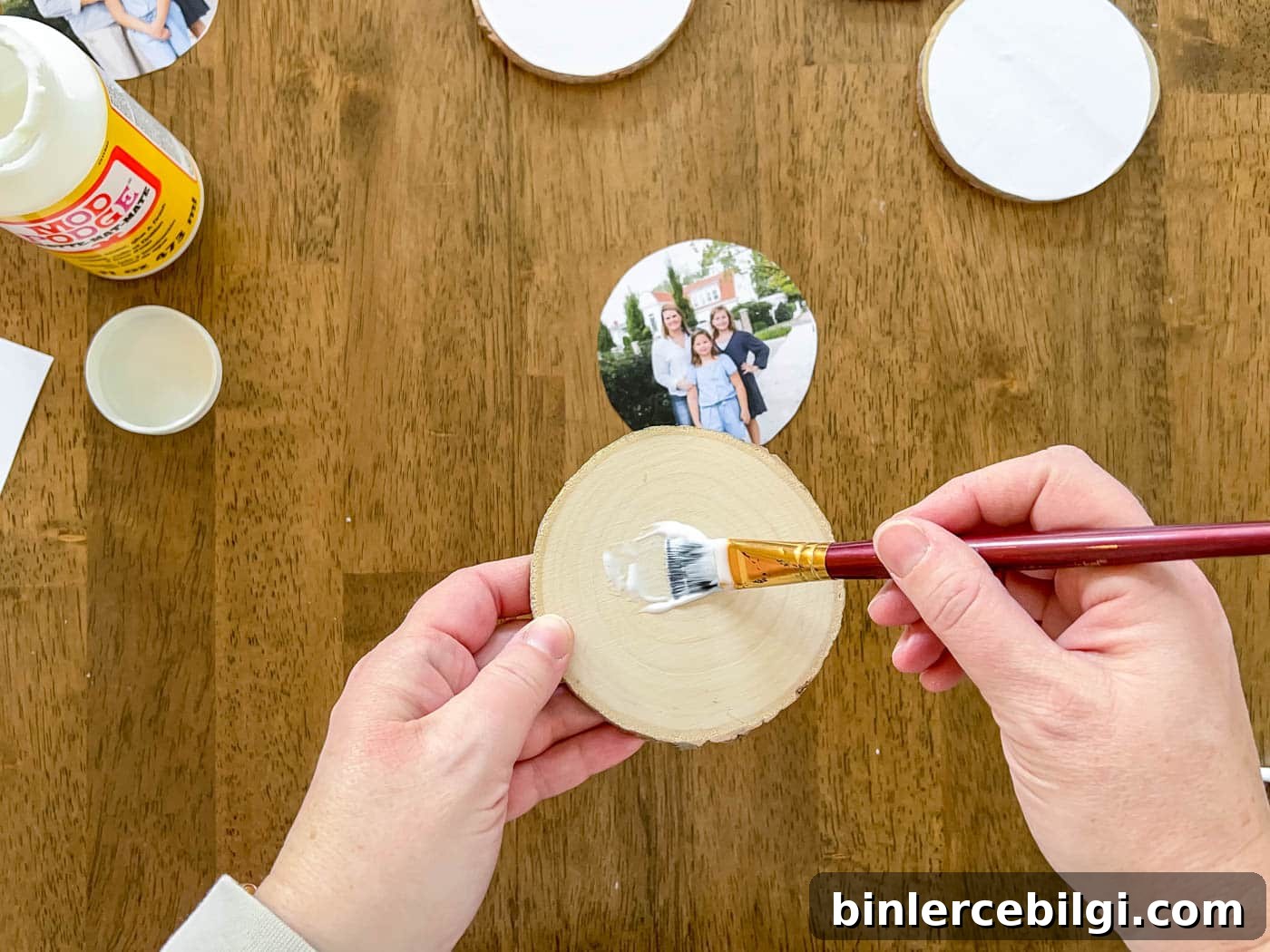 paint a layer of Mod Podge on the wood slice